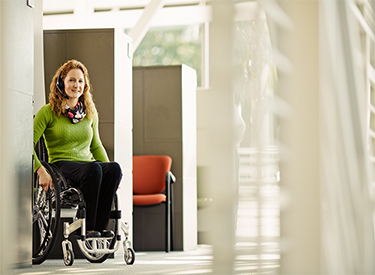 Tammy smiling and wearing a headset